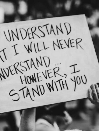 Sign reads "I understand I will never understand however I stand with you". Image by Zoe Vandewater