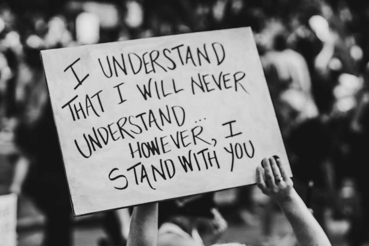 Sign reads "I understand I will never understand however I stand with you". Image by Zoe Vandewater